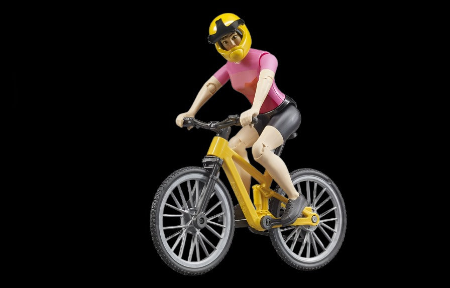Bruder mountain bike with female cyclist –